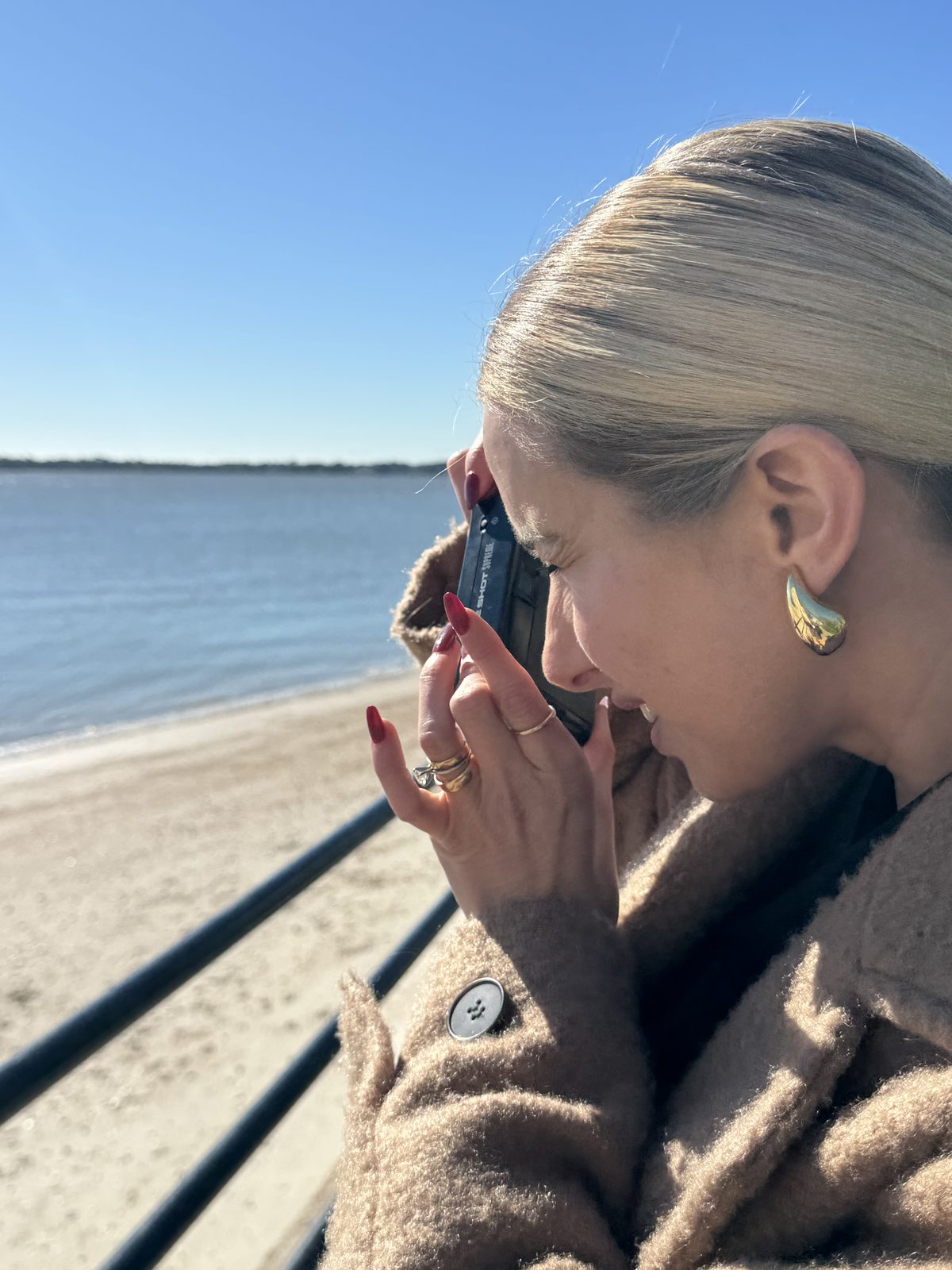 Shooting along the water in a winter coat