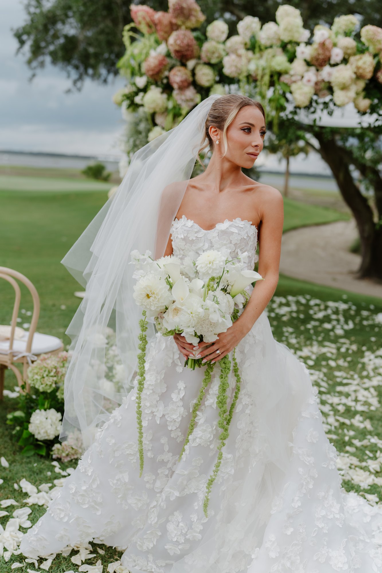 Paige with her bouquet on the lawn