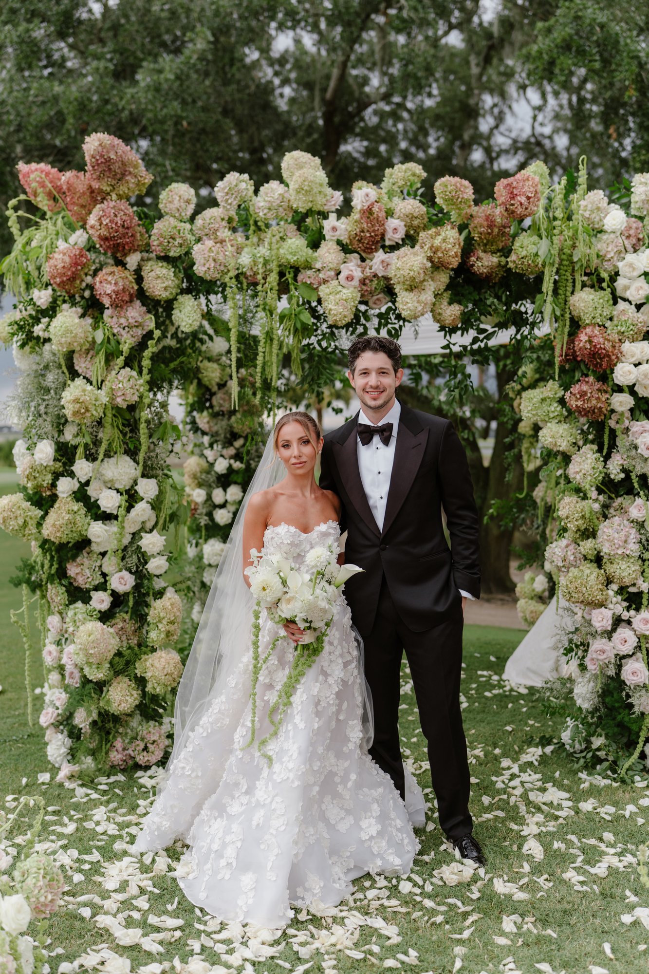 Paige and Jake at the floral arch